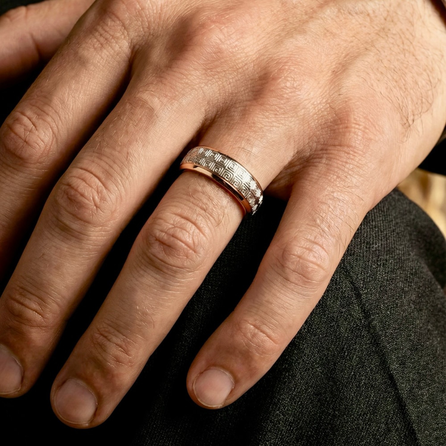 Two-tone gold wedding band featuring a continuous white gold Greek Key pattern with polished yellow gold rails.