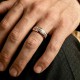 Two-tone gold wedding band featuring a continuous white gold Greek Key pattern with polished yellow gold rails.