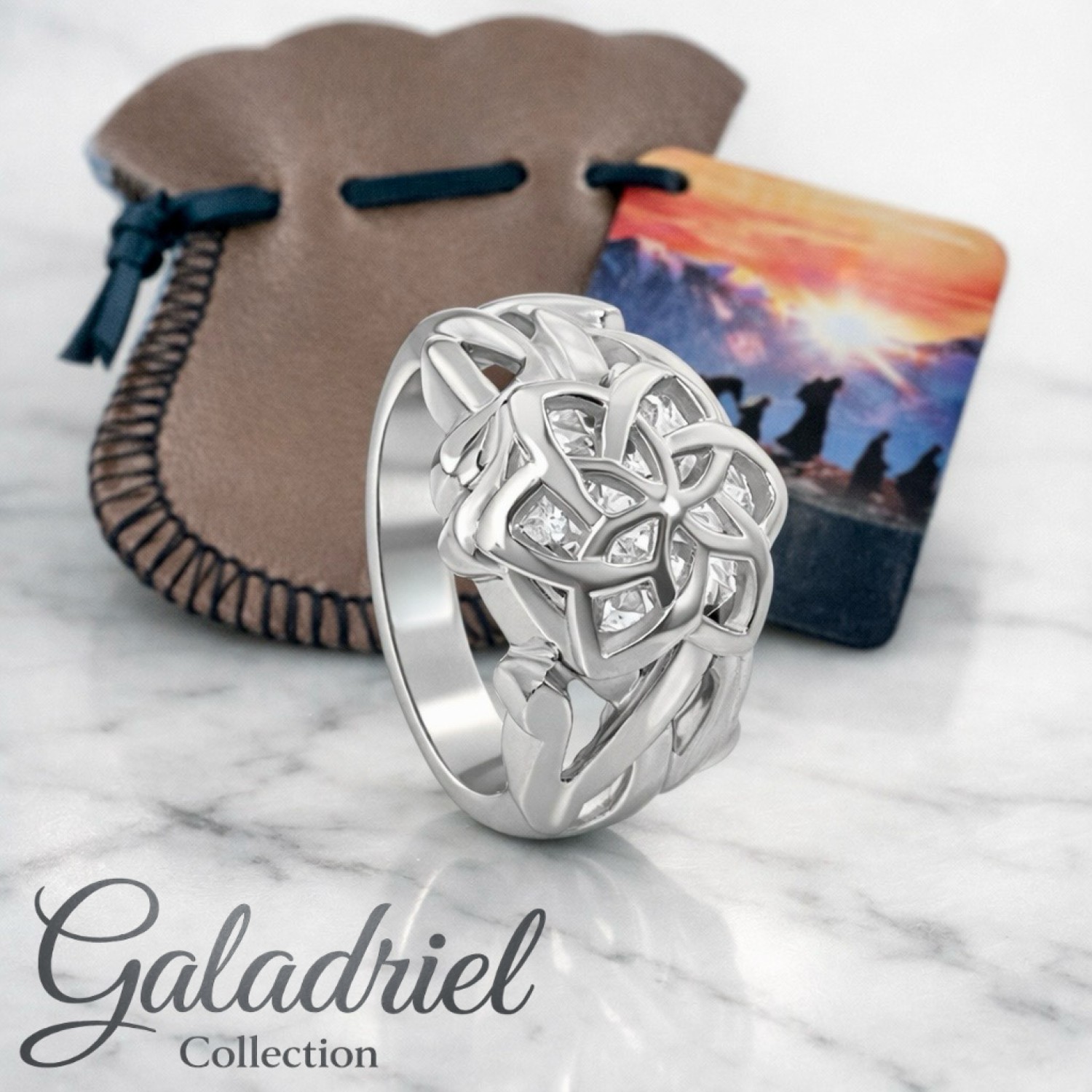 Official Nenya Ring of Galadriel in solid 925 sterling silver with cage-set cubic zirconia, Mallorn leaf design, handcrafted in New Zealand by Lord of the Rings licence holders — available in clear, blue, and purple stone