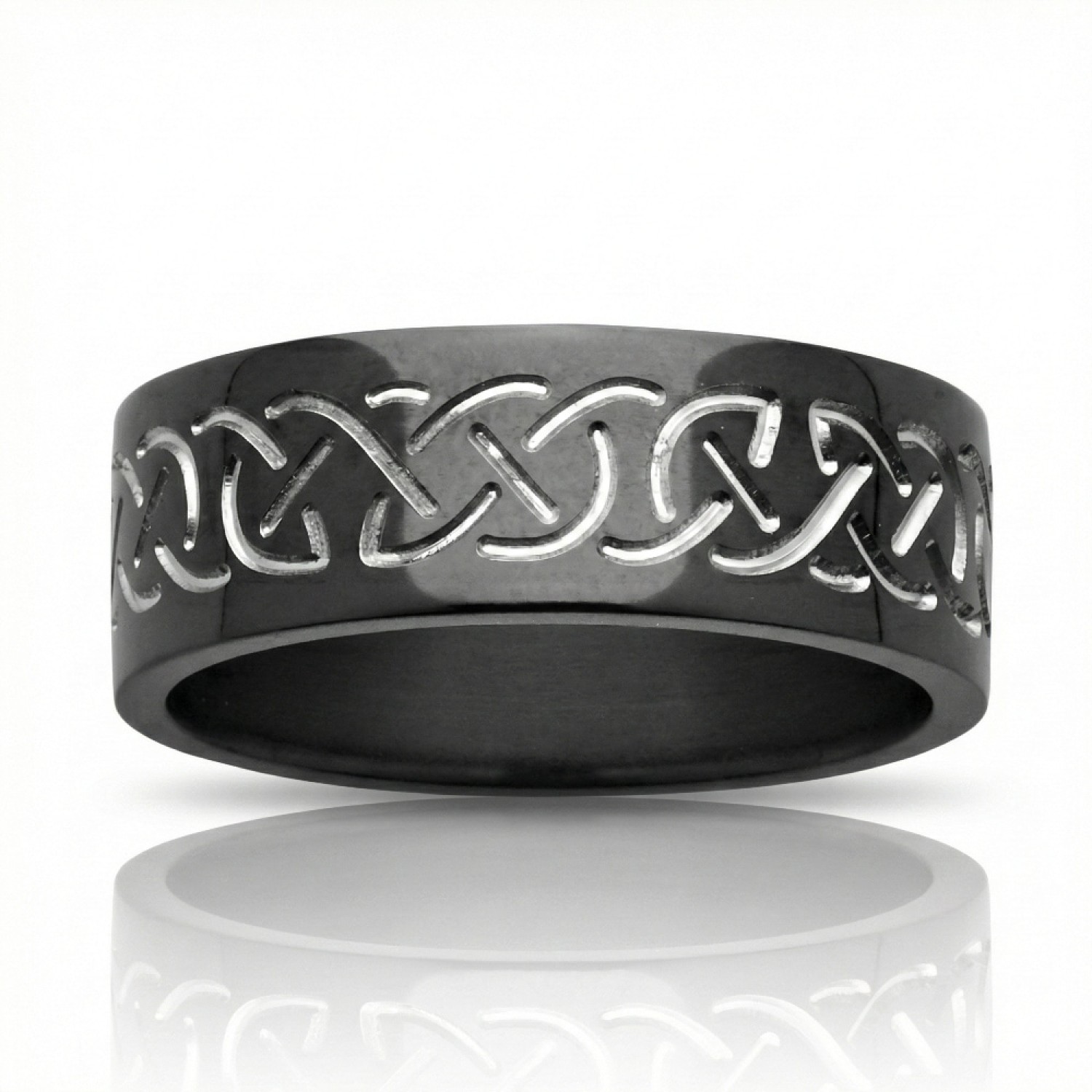 A polished black zirconium wedding ring featuring a contrasting engraved silver-toned Celtic eternity knot pattern, cast against a white background with a reflection below.