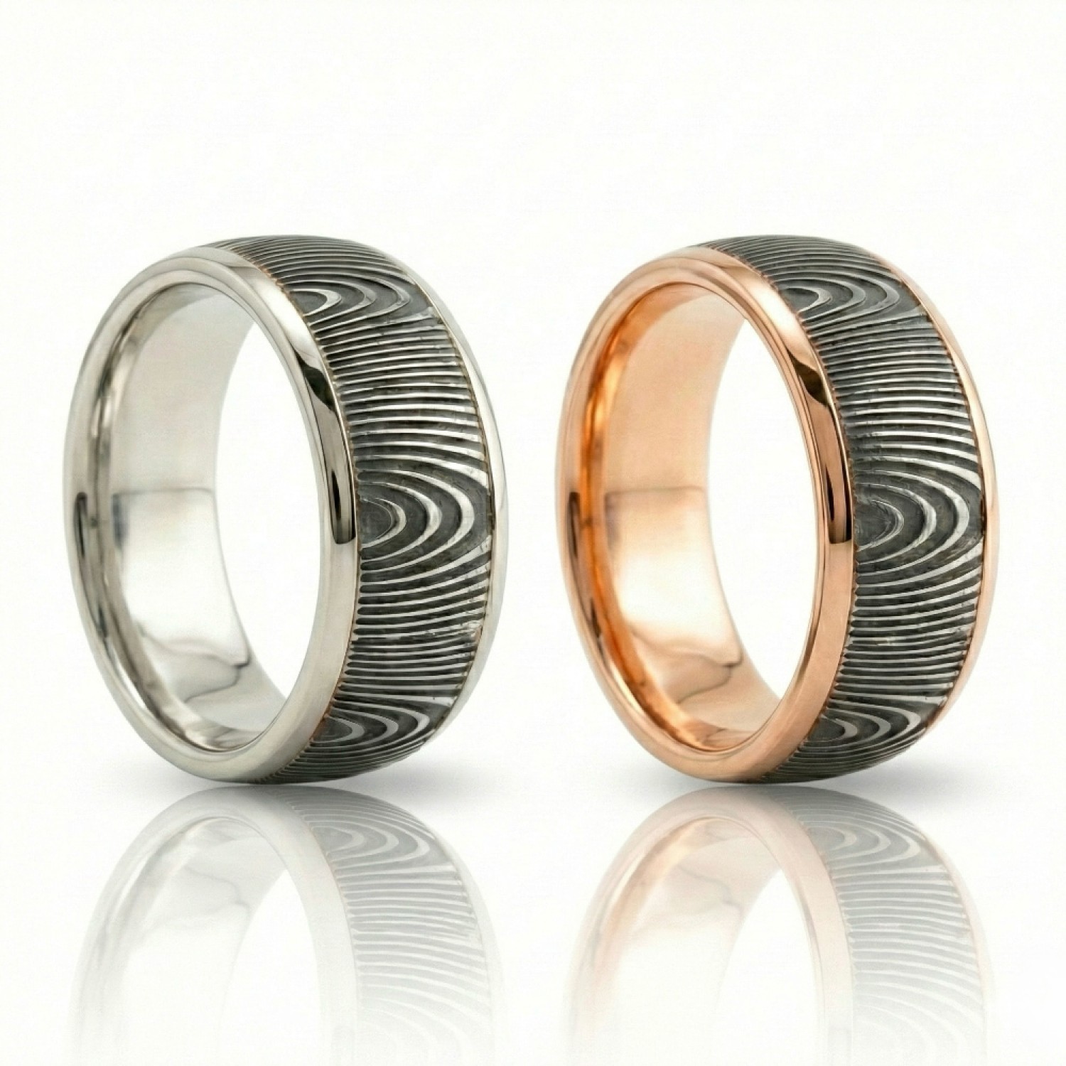 The Strata Wedding Ring: A polished yellow gold band featuring a central inlay of laser-carved black zirconium with a wavy woodgrain pattern, standing on a white background.