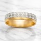 Two-tone gold wedding band featuring a continuous white gold Greek Key pattern with polished yellow gold rails.